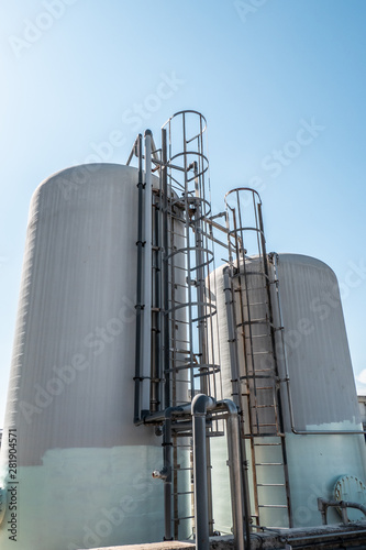 industrial fiberglass tanks with metal ladder and flange with bolts photo