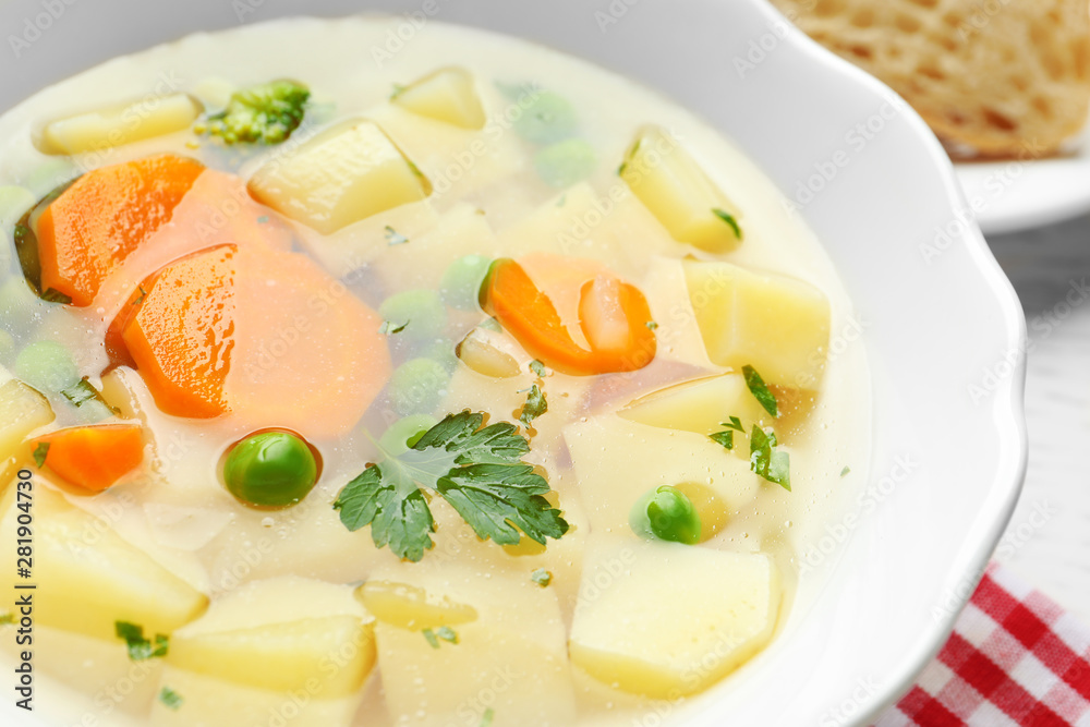Bowl of fresh homemade vegetable soup on table, closeup Bowl of fresh homemade vegetable soup on table, closeup