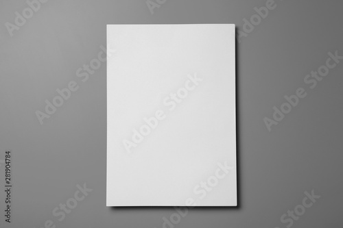 Blank paper sheets for brochure on grey background, top view. Mock up