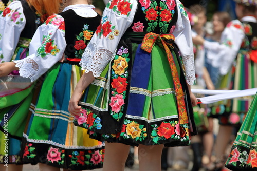 Polish women in traditional folk dresses walk in Corpus Christi procession in Lowicz