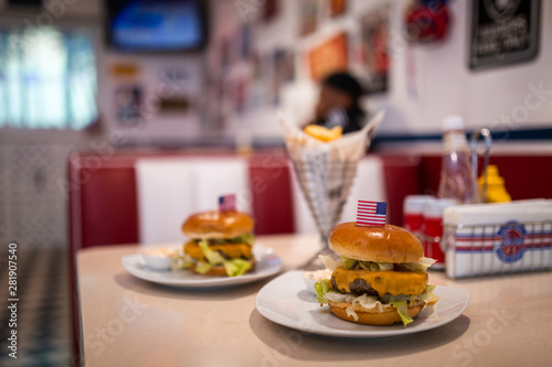 Juicy Cheeseburgers and Fries in American Diner