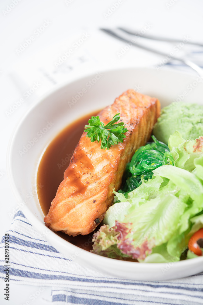 Salmon fish steak grilled and fresh vegetable salad Salmon fish steak grilled and fresh vegetable salad