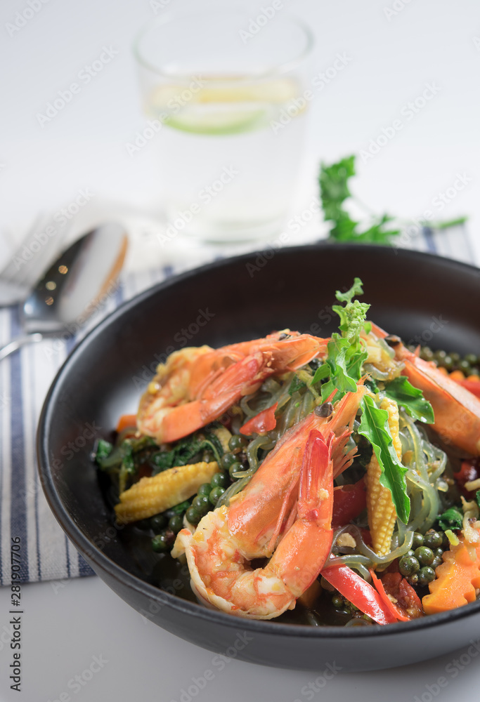 Spicy stir fried noodles with shrimp and holy basil leaves