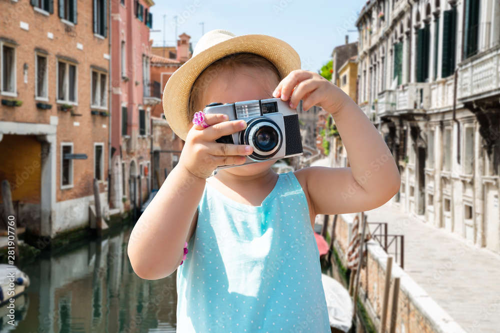 Little Girl Holding Camera In Front Of Her Face