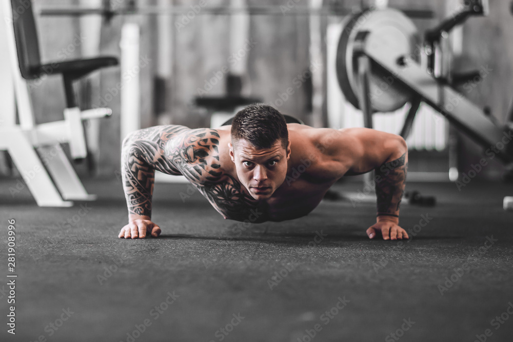 purposeful bodybuilder performing statistical exercise. photo with copy space