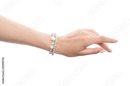 Hand wearing silver jewelry bracelet isolated on white background photo