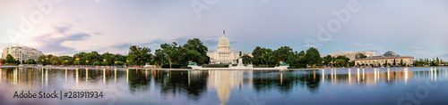 Panorama view of the United States Capitol building reflected on the reflection pool when sunset at nation mall, Washington DC, USA. photo