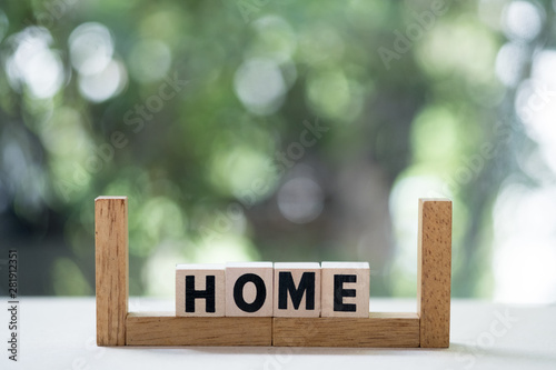 Wooden cubes with word home with copy space