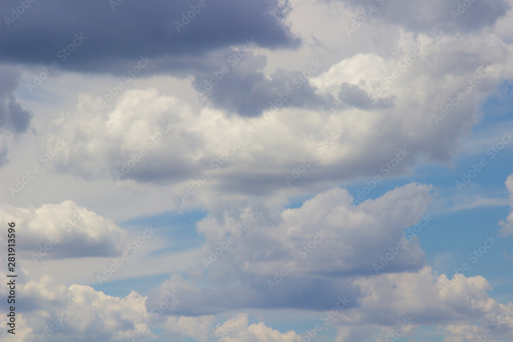 Rain cumulus clouds against blue sky. Rain cumulus clouds against blue sky.