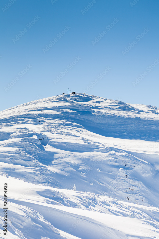 Untersberg Summit.  Looking towards the summit of Untersberg mountain in Austria.  The summit is marked by a cross and the mountain straddles the border between Germany and Austria.