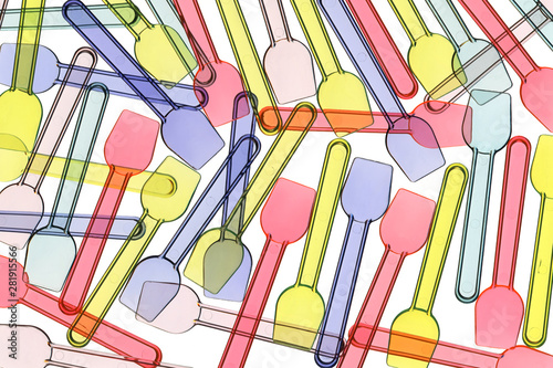 Background of plastic ice cream spoons