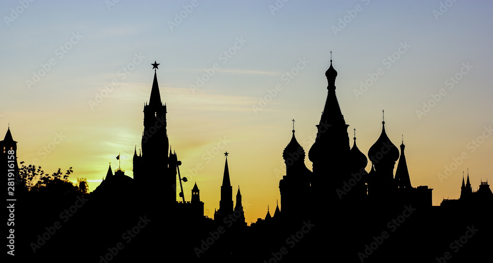 Moscow Kremlin skyline silhouette at sunset with the sun behind the buildings