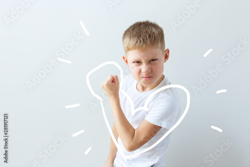Child shows his force in the bent hand. Muscles