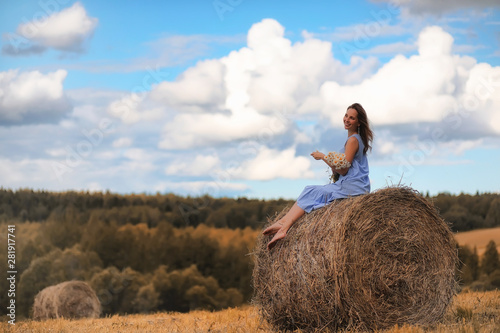 Two girls in dresses in autumn field