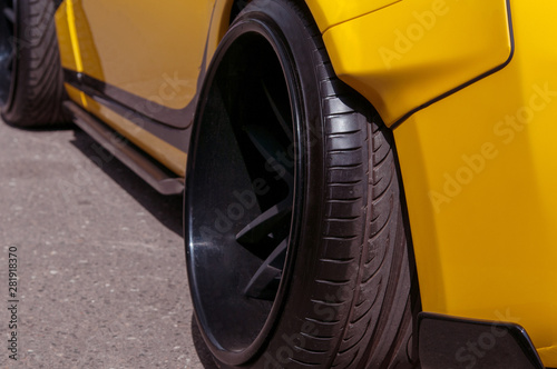 black alloy wheels. racing yellow car. drift, sports car. extreme sport