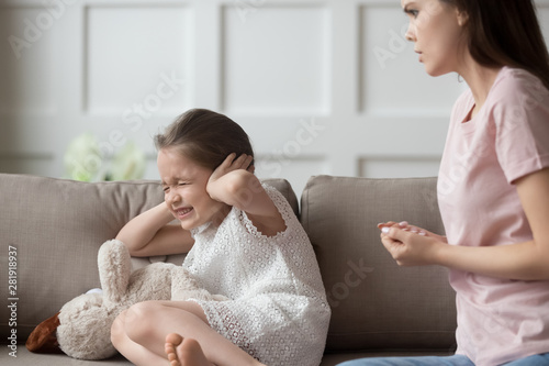 Obraz na plátně Naughty little daughter close her ears not listen mothers rebuke