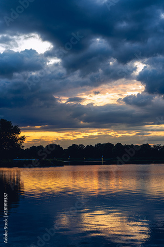 german water lake called HERNER MEER at the evening with very nice clouds sunset