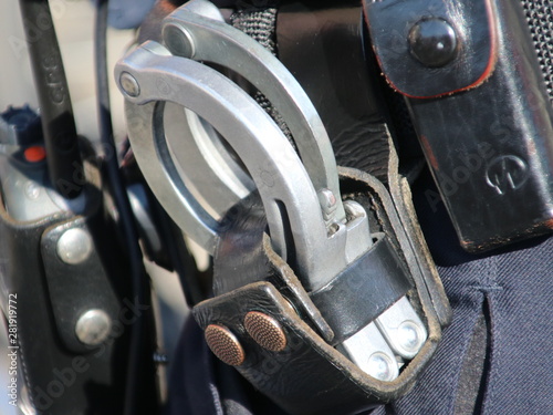 handcuffs at the belt of a police officier in the Netherlands as general equipment;