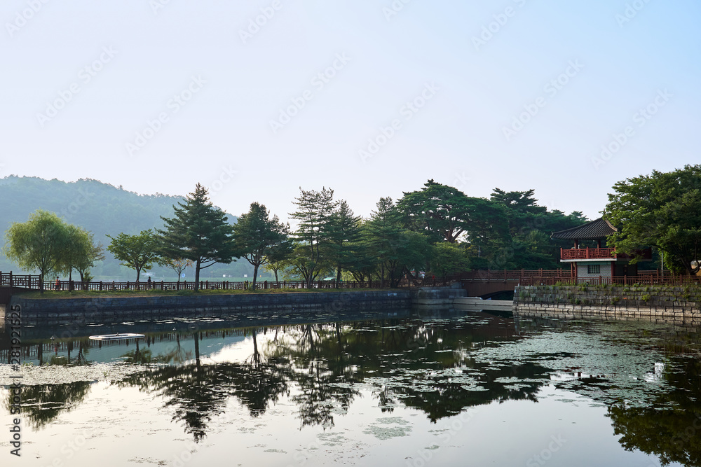 A view of the reflection of a gazebo and the trees at Uirimji Reservoir in Jechun, South Korea.