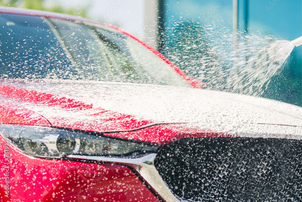 Car wash with soap. Manual car wash with pressurized water in car wash