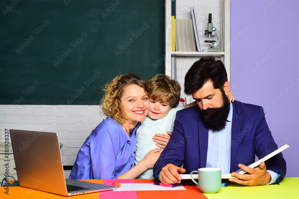 Pupil learning letters and numbers with parents. Mother father and son together schooling. Education for kids out of school. Boy from elementary school. Education concept. Little boy and his parents. Pupil learning letters and numbers with parents. Mother father and son together schooling. Education for kids out of school. Boy from elementary school. Education concept. Little boy and his parents.
