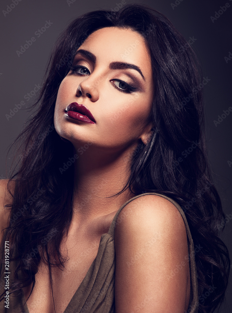 Beautiful bright makeup woman with long black curly hair style