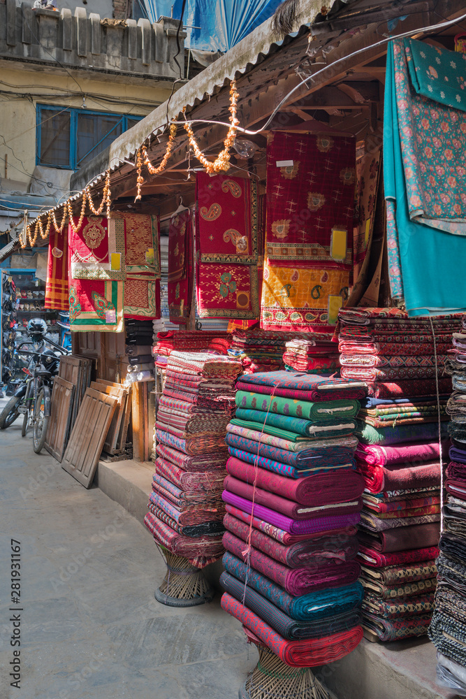 Pashmina, woolen plaids, silk scarfs and weightless pareo on asian market