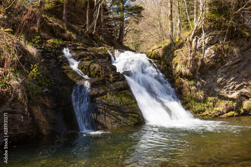Small waterfall on a mountain river in Spring