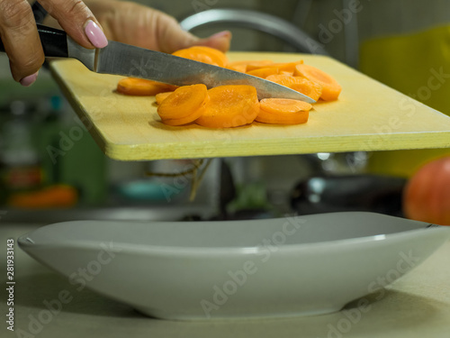 sliced carrots on a wooden board