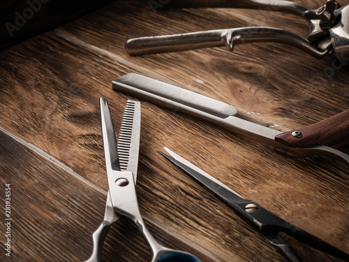the barber shops tools on wooden desk.
