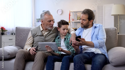 Multiage family members choosing presents online, mobile shopping application