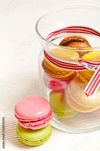 elegant glass jar wir rustic ribbon filled with macarons photo