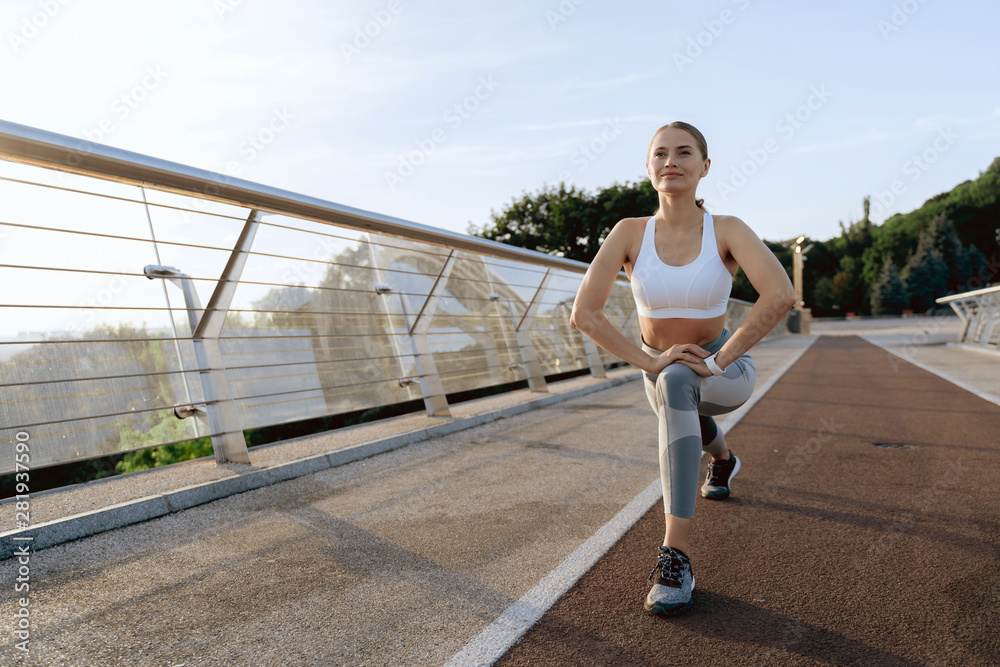 Happy athletic lady on workout training outdoor
