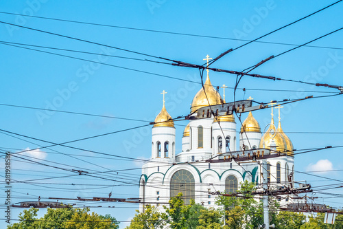 Wires of electric transport on the background of the Orthodox Church. Wires in the city are the enemies of the photographer.