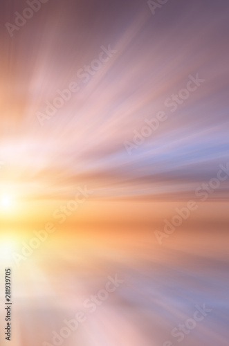 Abstract Bright sun at sunset on the background of small sea waves.