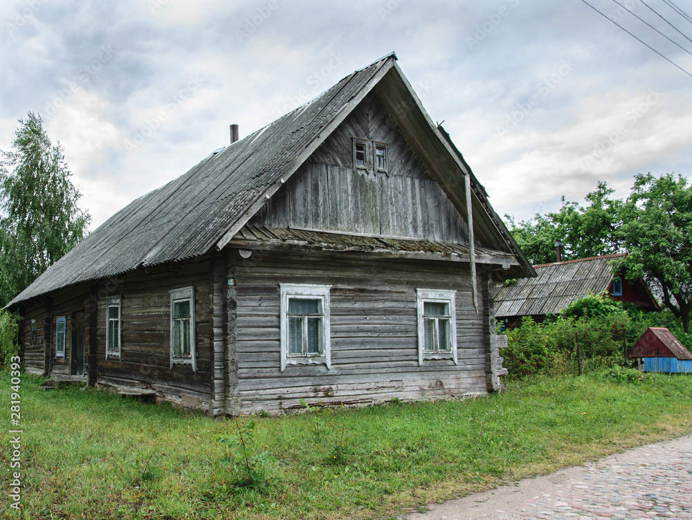Old wooden weathered abandoned house in village. Old wooden weathered abandoned house in village.