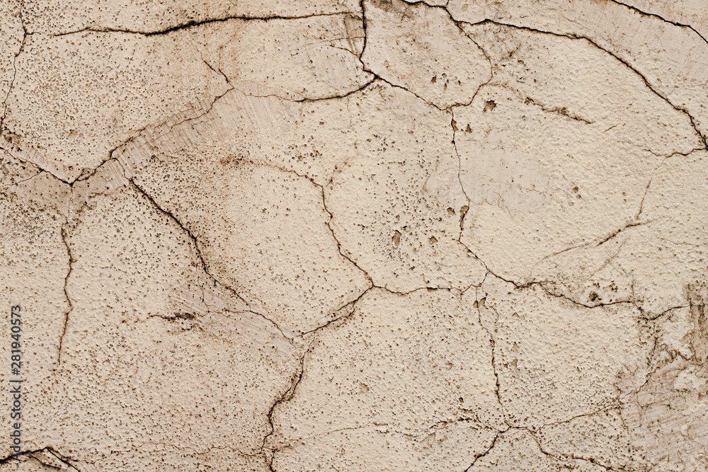 The texture of the plastered wall, the exterior of the building, the old wall cladding, cracked plaster The texture of the plastered wall, the exterior of the building, the old wall cladding, cracked plaster
