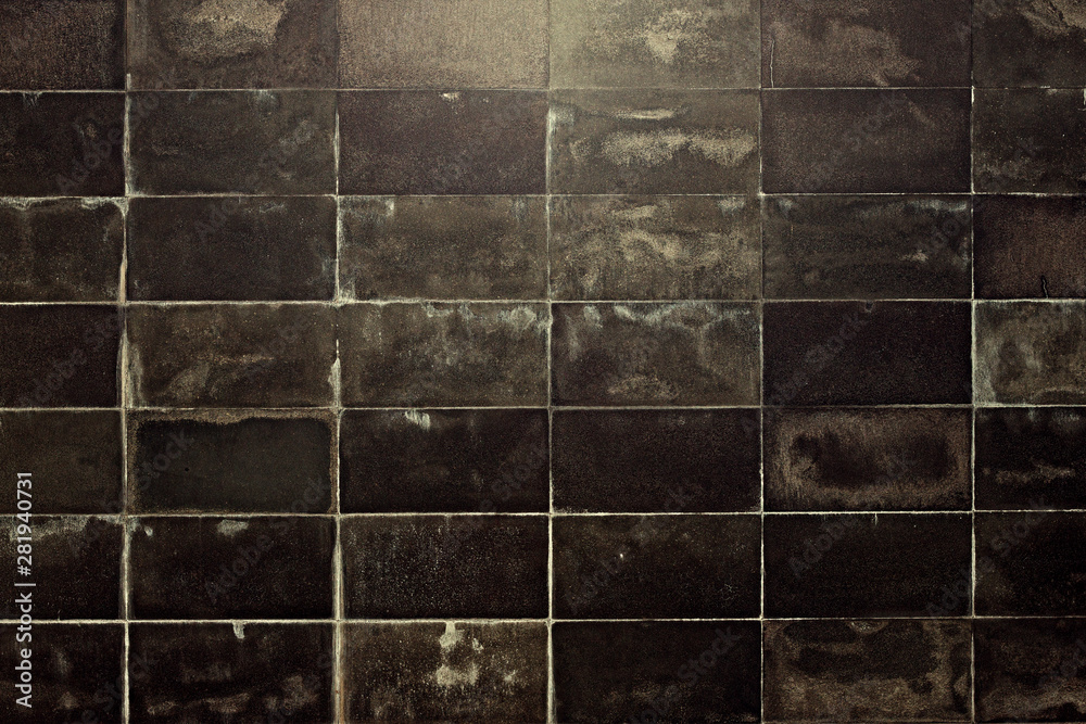 Naklejka premium The wall is finished with marble tiles, the texture of the marble facade of the building, the surface of the old marble blocks