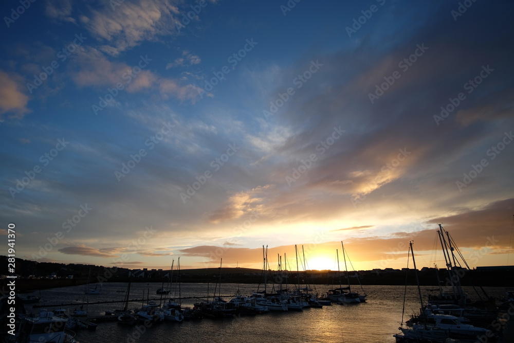 Sunrise in a harbor of Orkney