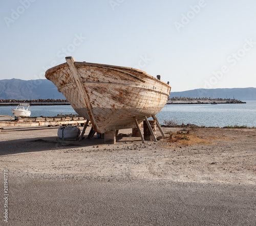 Large old rusty boat on a beach
