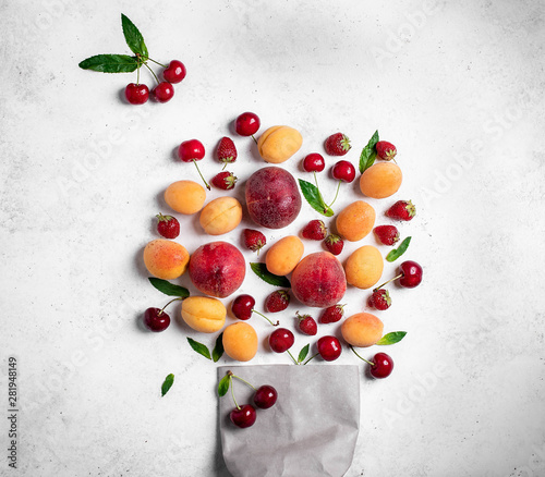 summer fruits and berries on a light background