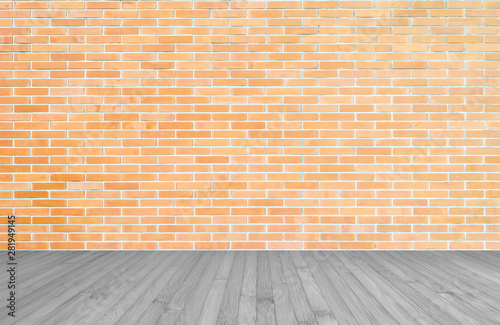 Orange-brown brick wall with wood floor in grey color background of interior decoration