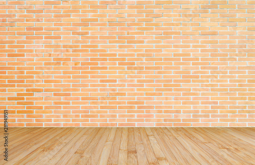 Orange-brown brick wall with wood floor in yellow brown background of interior decoration