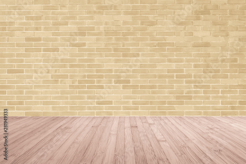 Light yellow brown brick wall with wooden floor in red brown