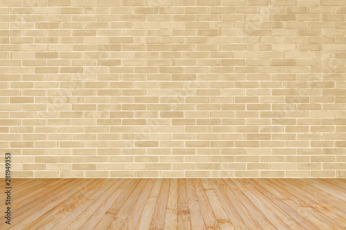 Light yellow brown brick wall with wooden floor