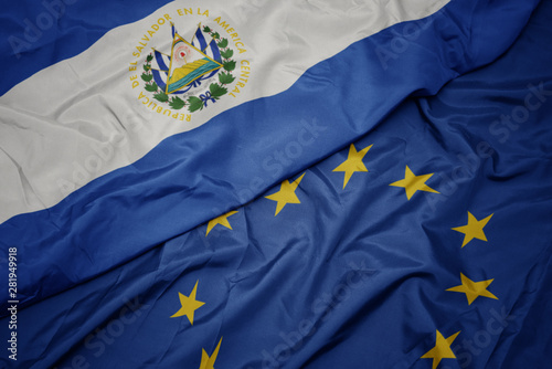 waving colorful flag of european union and flag of el salvador.