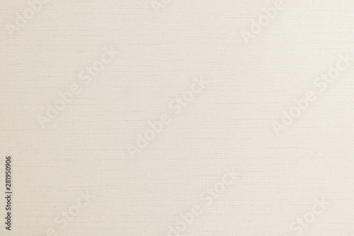 Woven cotton linen fabrics textile textured background in light cream beige color tone.