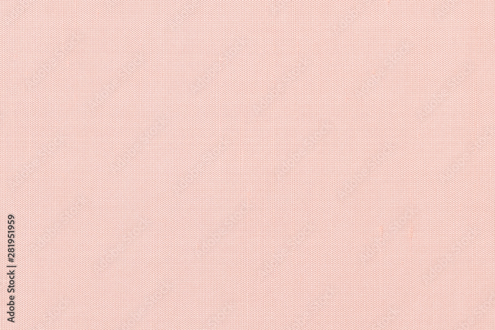 Pink satin silky fabric cloth wallpaper texture pattern background in  pastel pale sweet old pink orange beige color toned Stock Photo
