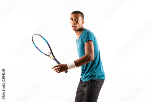 Afro American tennis player man over isolated white background . © luismolinero