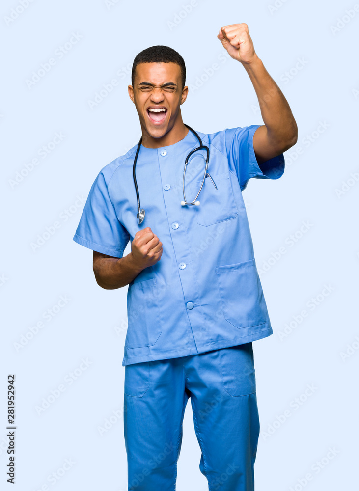 Surgeon doctor man celebrating a victory on isolated background Surgeon doctor man celebrating a victory on isolated background